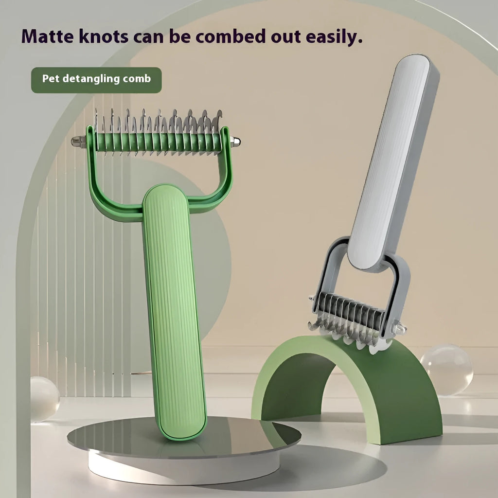 Green and grey pet hair unknotting comb for dogs with stainless steel teeth on a plastic handle.