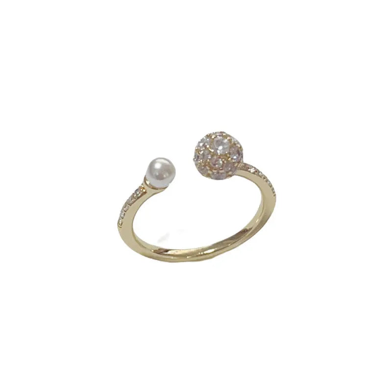 Adjustable open-end pearl ring with round zircon elements in gold plating