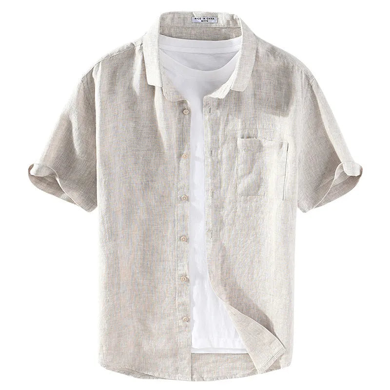Male youth model wearing a raw jute coloured linen shirt with a square collar and short sleeves, styled as a casual cardigan.