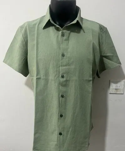Men's loose fit short sleeve linen shirt in apricot colour on a hanger.