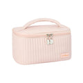 Open-top makeup bag in PU leather shown in a choice of six solid colours.