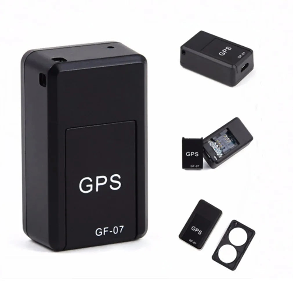 Small black magnetic GPS car tracker device with USB charging cable.