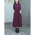 Purplish red long sleeve plus size dress for women, urban winter commute style.