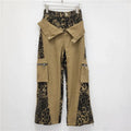 Dark khaki leopard print high waist jeans with straight legs and faux double stitching details