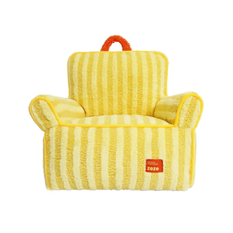 Striped orange plush fabric dog bed with a removable cover on a wooden floor.