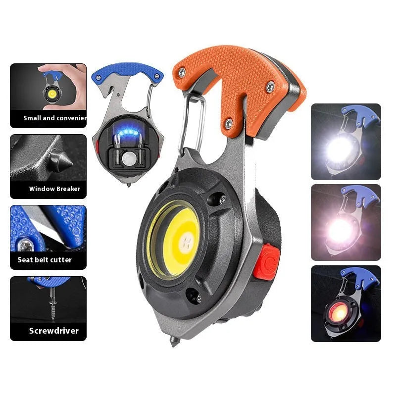 Compact silver and black multifunctional keychain flashlight with keyring, COB LED panel, and window breaker tool.