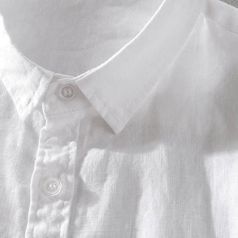 Men's loose fit short sleeve linen shirt in apricot colour on a hanger.