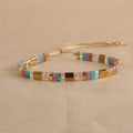 Geometric glass bead bracelet with pull design in milky white colour
