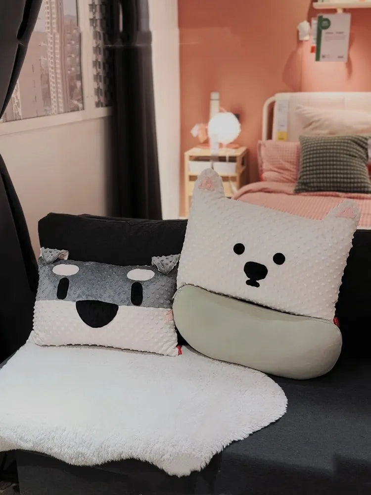 West Highland Terrier shaped decorative cushion pillow on a sofa.