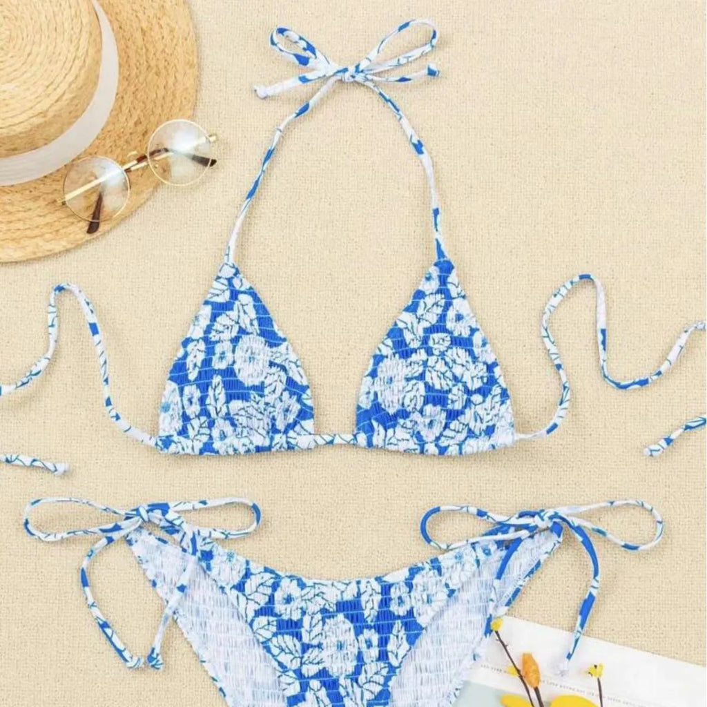 Women's multi-colour halter neck swimsuit bikini set with floral pattern on a mannequin