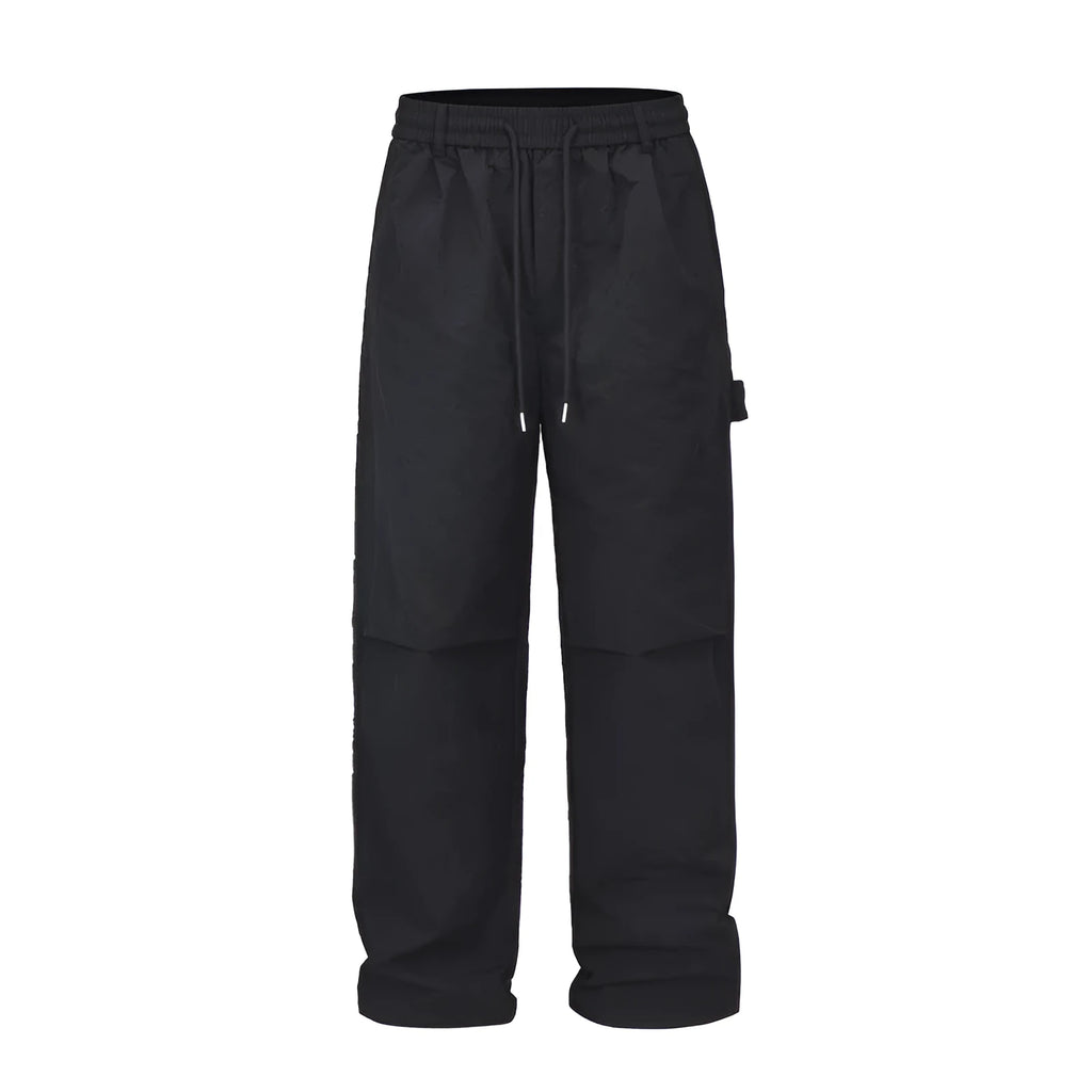 Black tooling paratrooper trousers with three-dimensional cutting and drawstring waist closure