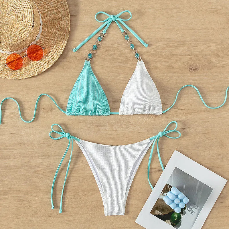 Colour matching women's swimsuit with lace-up front and pearl chain detailing