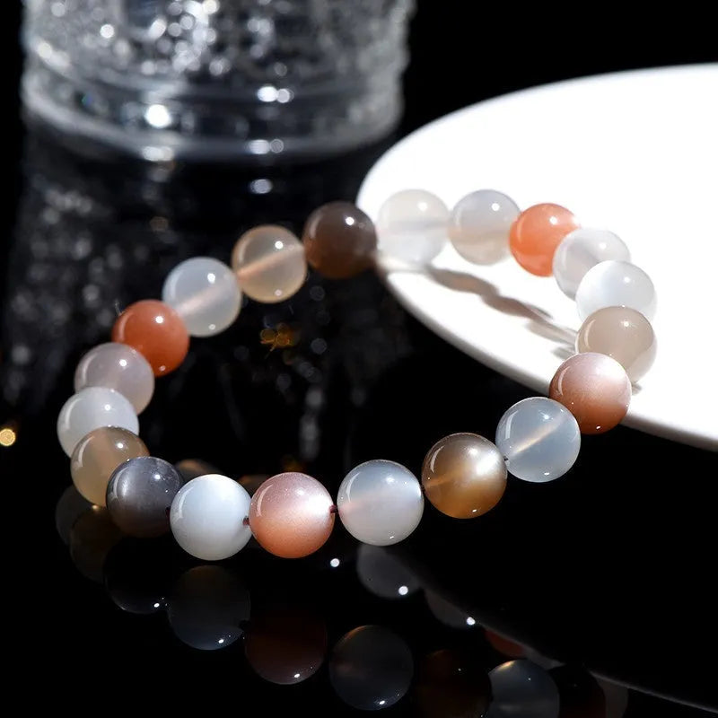 Natural colourful moonlight moonstone bracelet with 8mm beads on wrist.