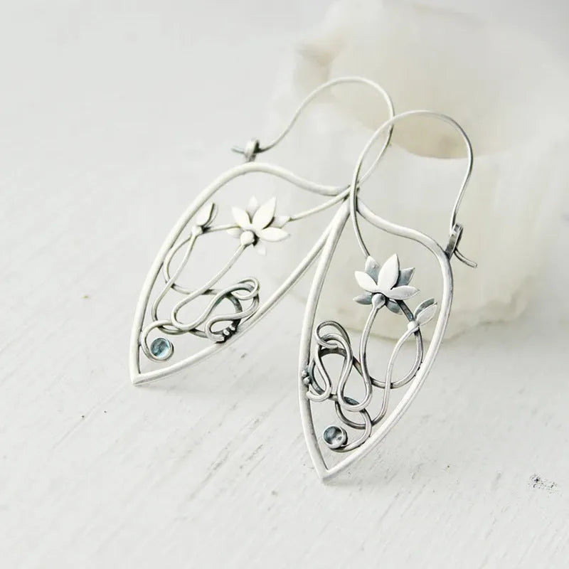 Silver retro style alloy earrings with lotus vine and geometric flower design featuring round rhinestones