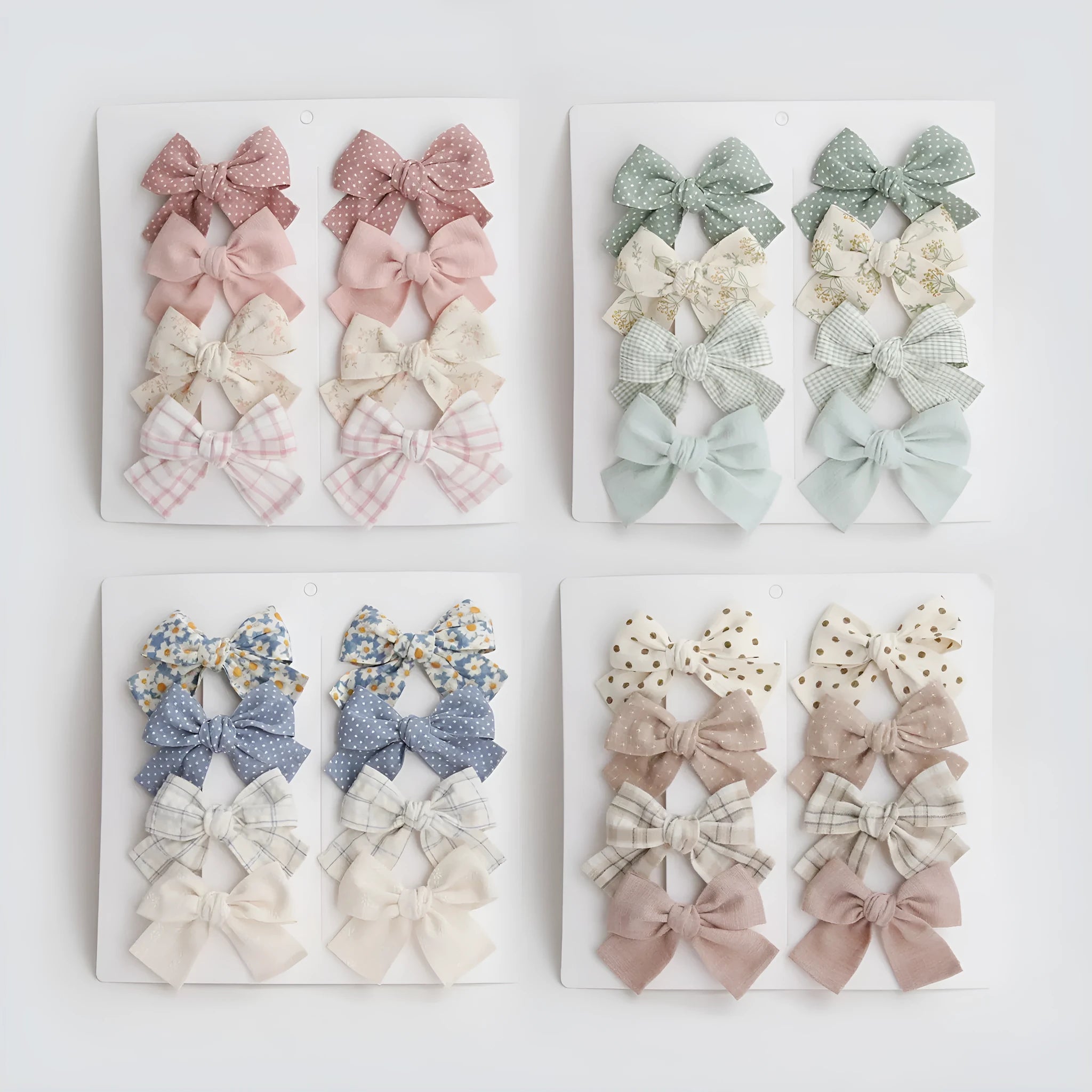 Children's fabric bow hairclip set showing eight different colour patterns including polka dots and floral designs