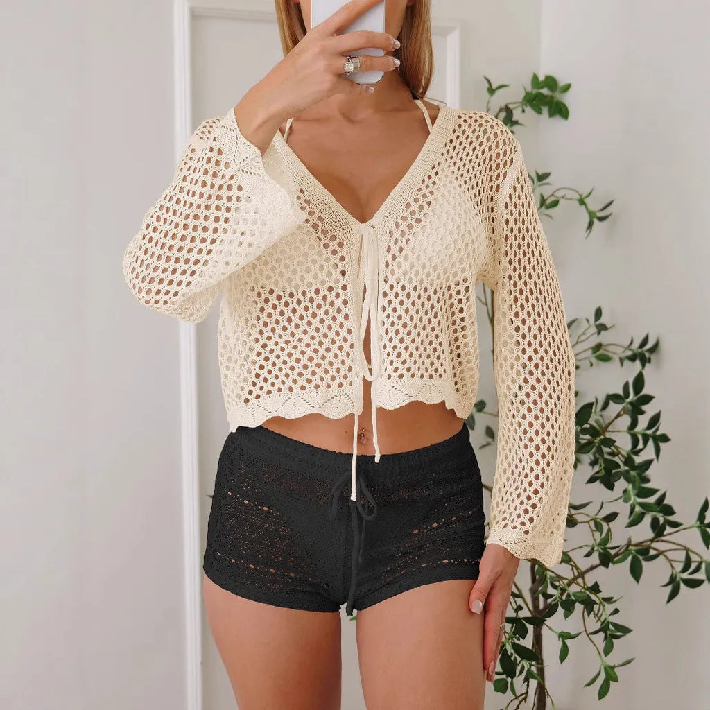Women's apricot hollow woven cardigan blouse with bell sleeves, shown laid flat.