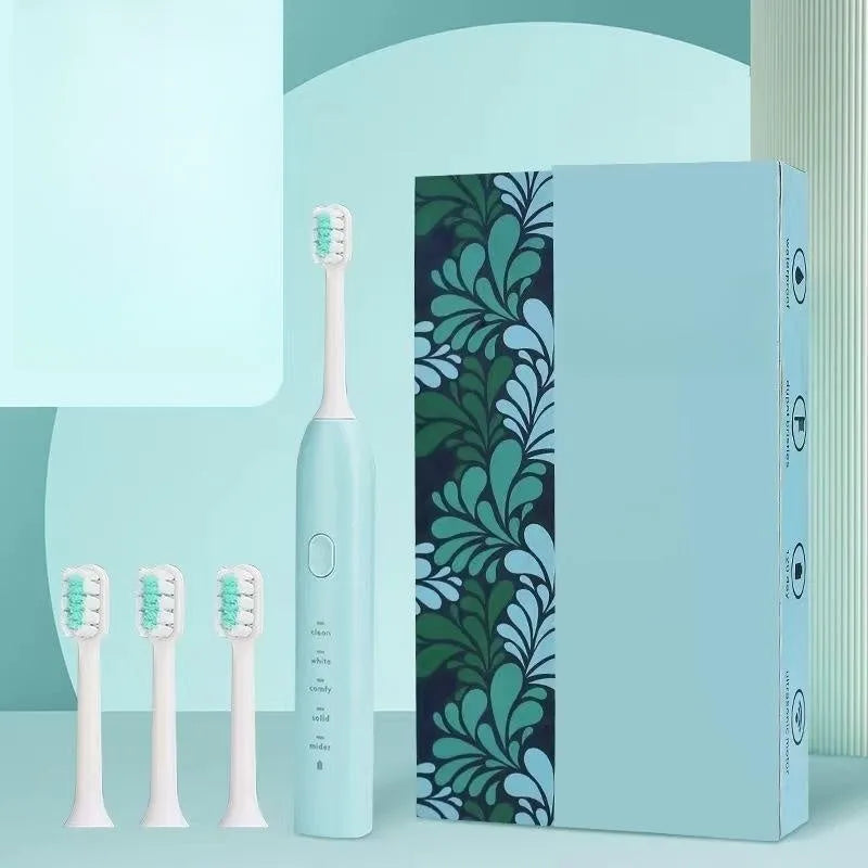 Yellow rechargeable electric toothbrush with soft bristles on a bathroom counter