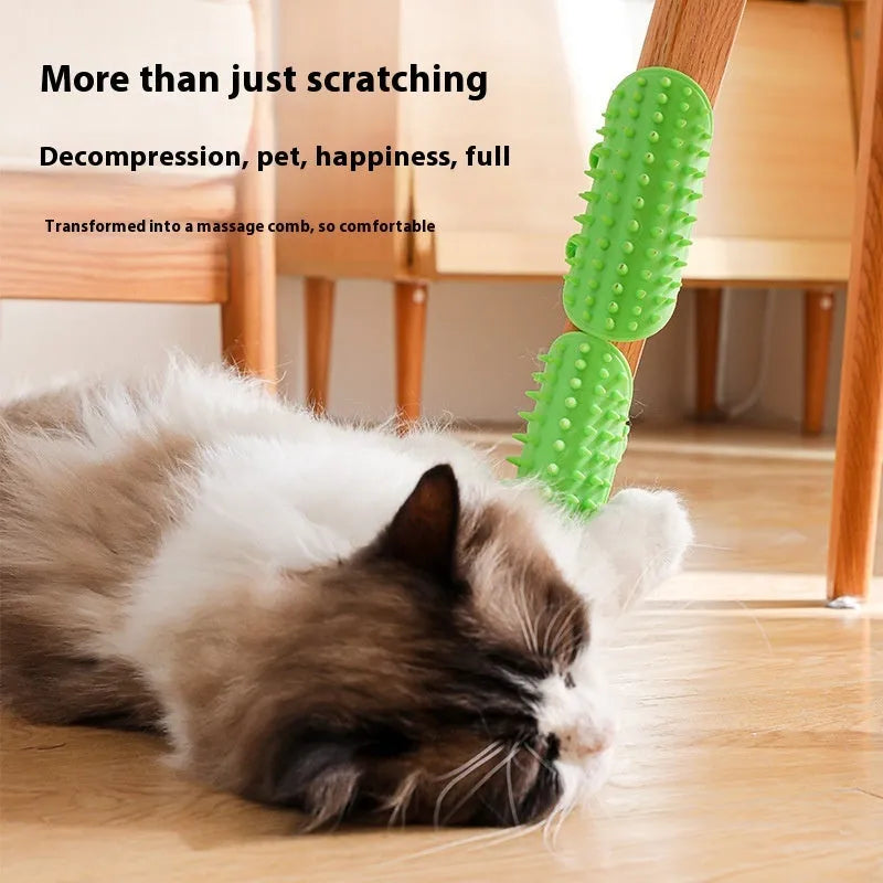 Silicone cat grooming comb with adjustable strap mounted on a table leg, shown in yellow.