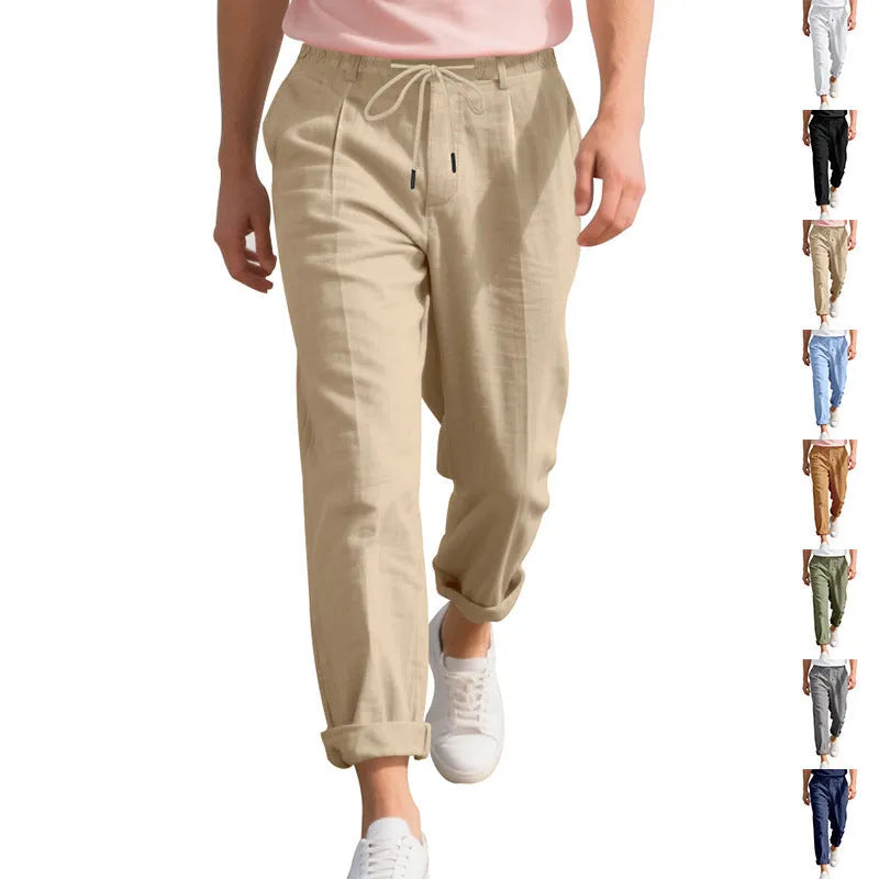 Men's light khaki linen casual trousers with a drawstring waist and straight leg fit.