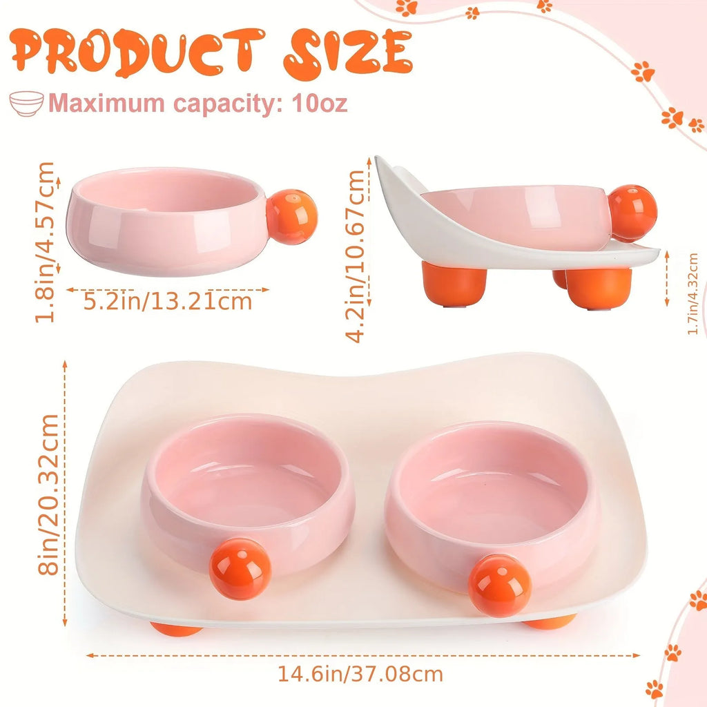 Elevated ceramic pet feeder with two bowls and non-slip base in pink, for cats and small dogs.