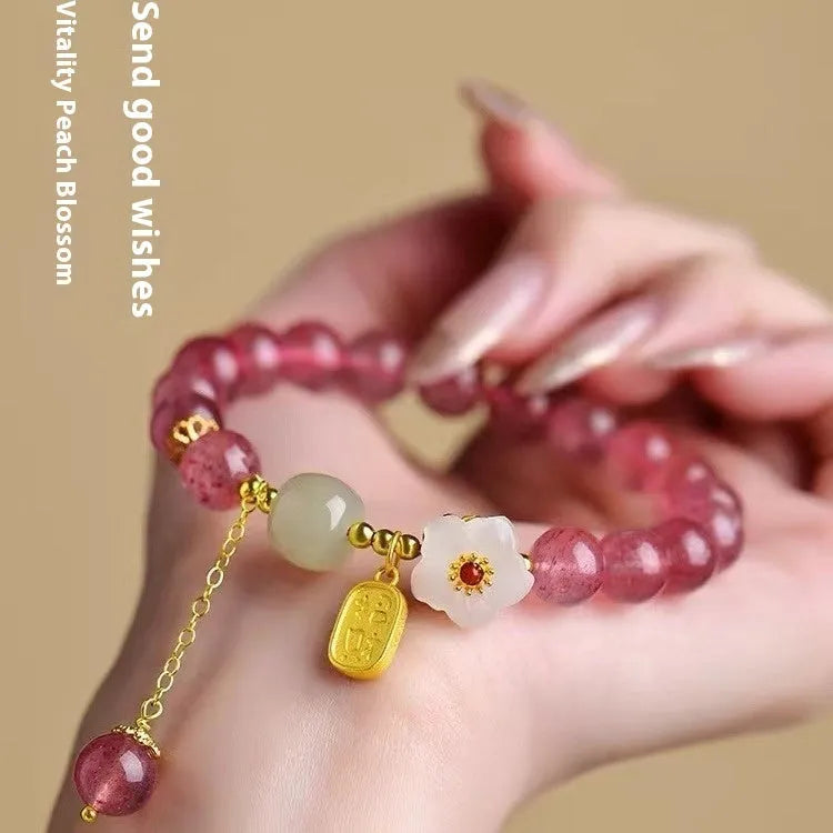 Handmade Hetian jade peach blossom strawberry quartz crystal bracelet for women showing strawberry quartz pearl and charm details