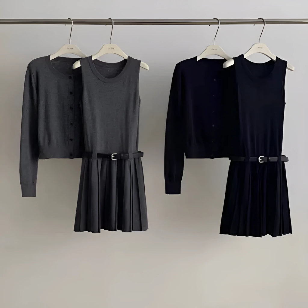 Women's grey knitted cardigan and pleated vest skirt two-piece set with a belt.