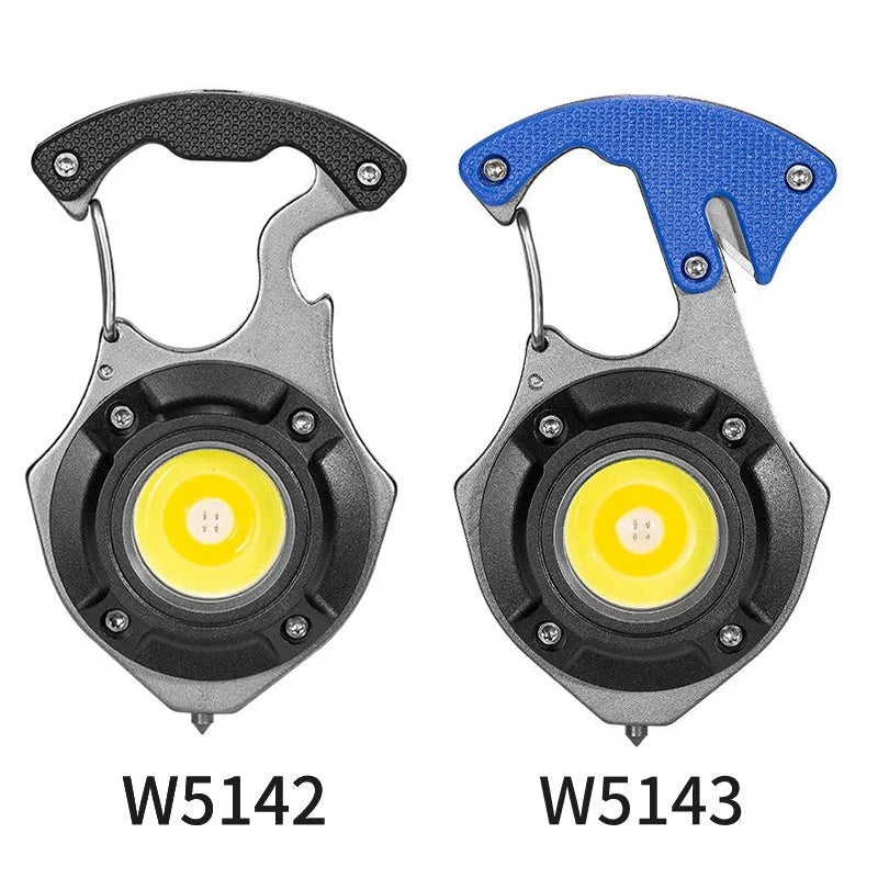 Compact silver and black multifunctional keychain flashlight with keyring, COB LED panel, and window breaker tool.