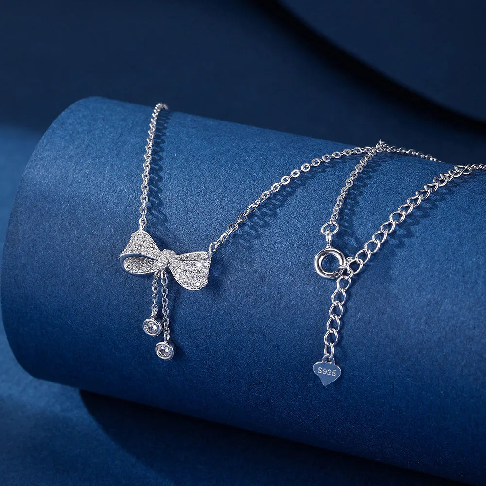 S925 sterling silver bow pendant necklace on adjustable O-ring chain, clavicle length