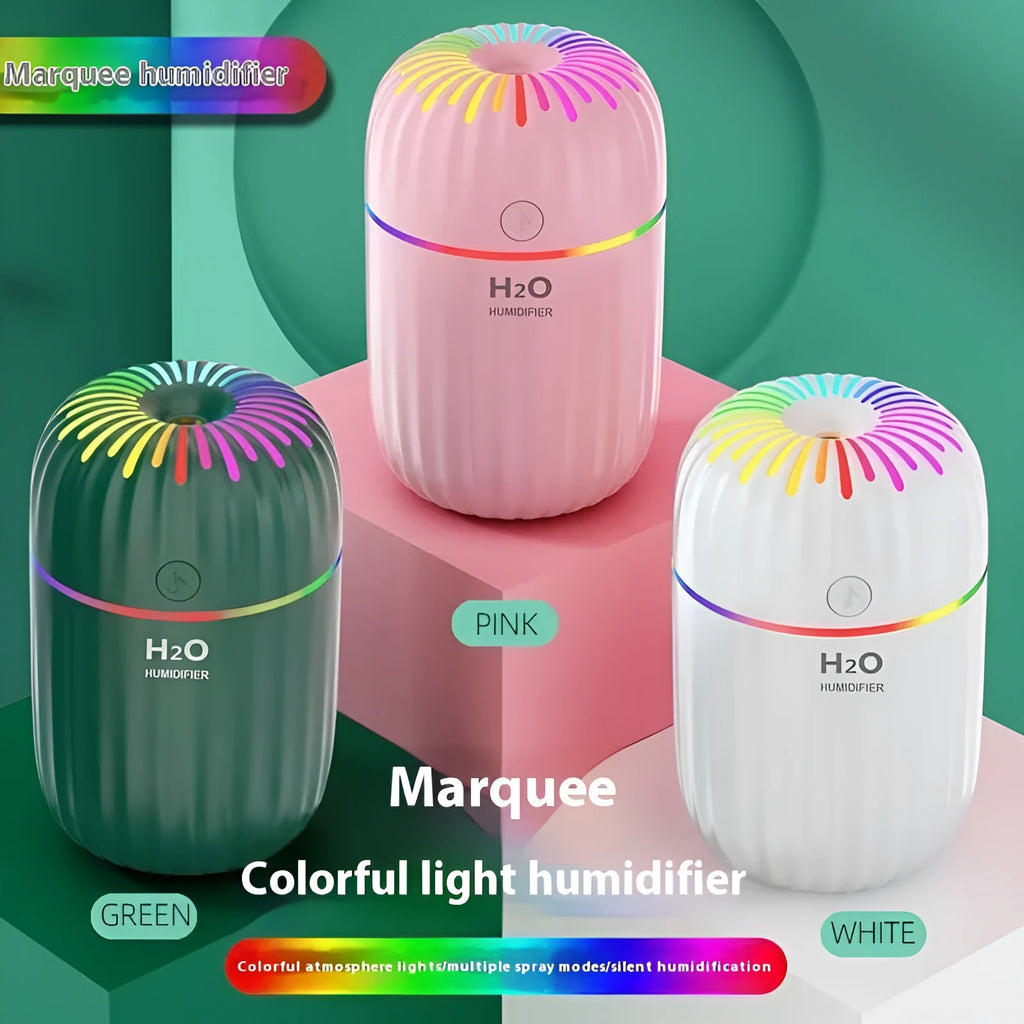 Mini USB aromatherapy humidifier in animal design with green, pink, and white colour options on a white background.