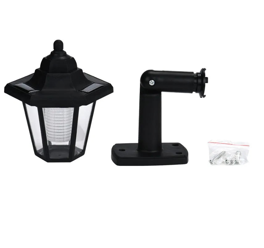 Black hexagonal solar-powered outdoor wall lamp with LED light.
