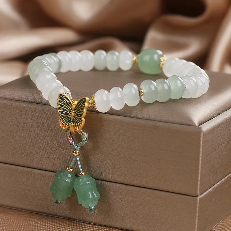Green retro butterfly tassel bracelet with crystal beads, pearls, and rhinestones