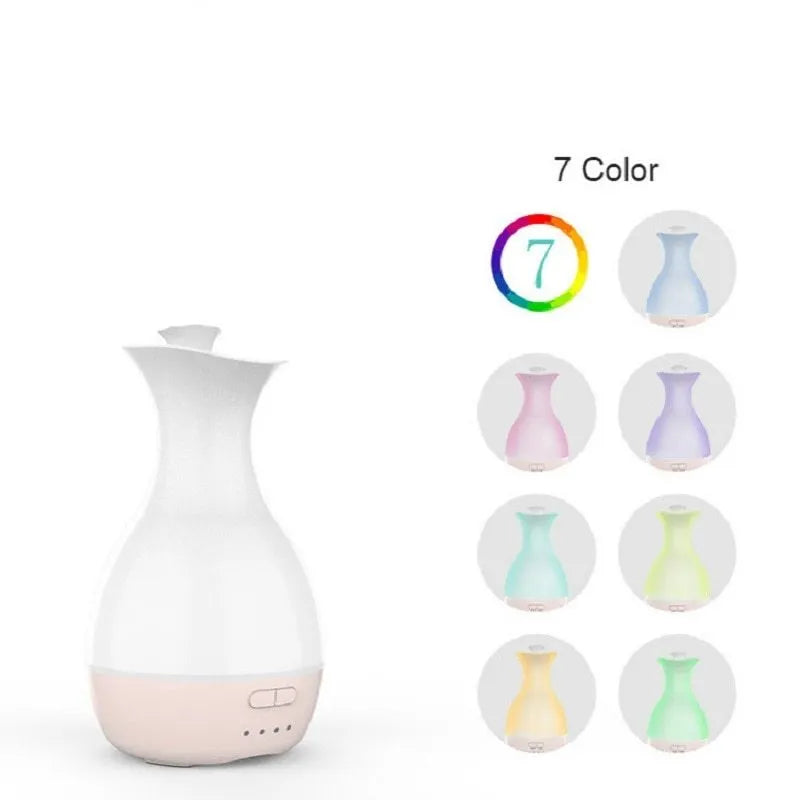 White or pink ultrasonic humidifier and essential oil diffuser vase with colourful LED night light.