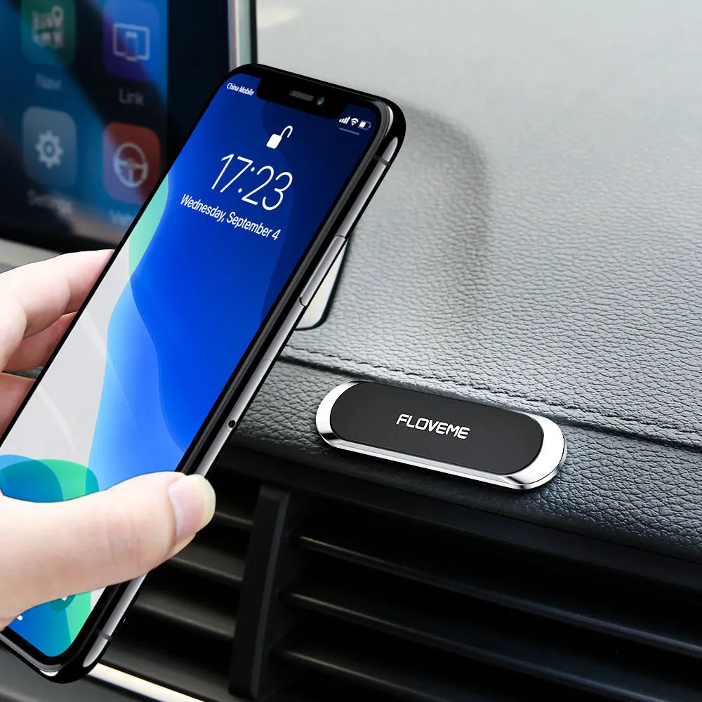 Black magnetic car phone holder with 70mm base plate and foam glue backing for dashboard mounting