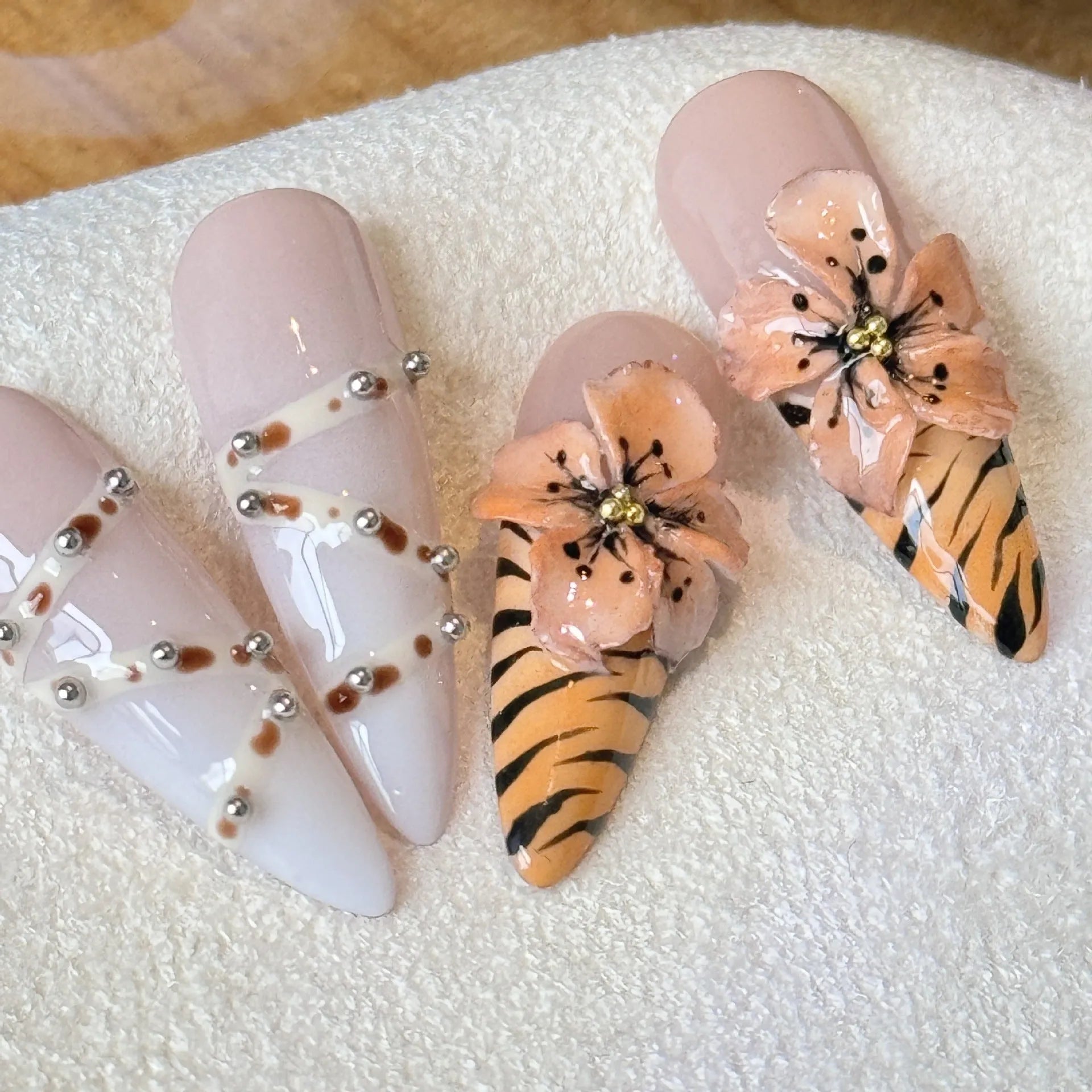 Set of 10 reusable gel nail stickers with French style leopard, cross, and flower print designs.