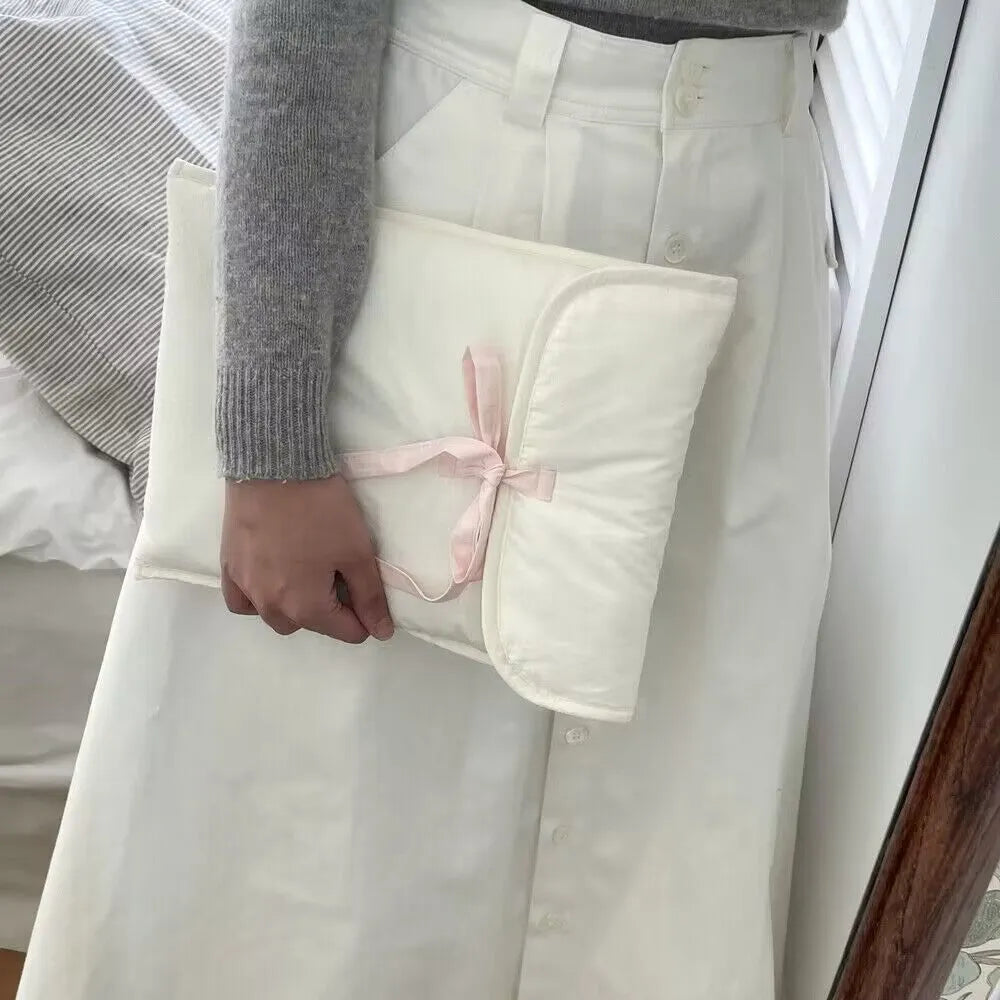 Women's black and white striped quilted laptop bag with ballet bow