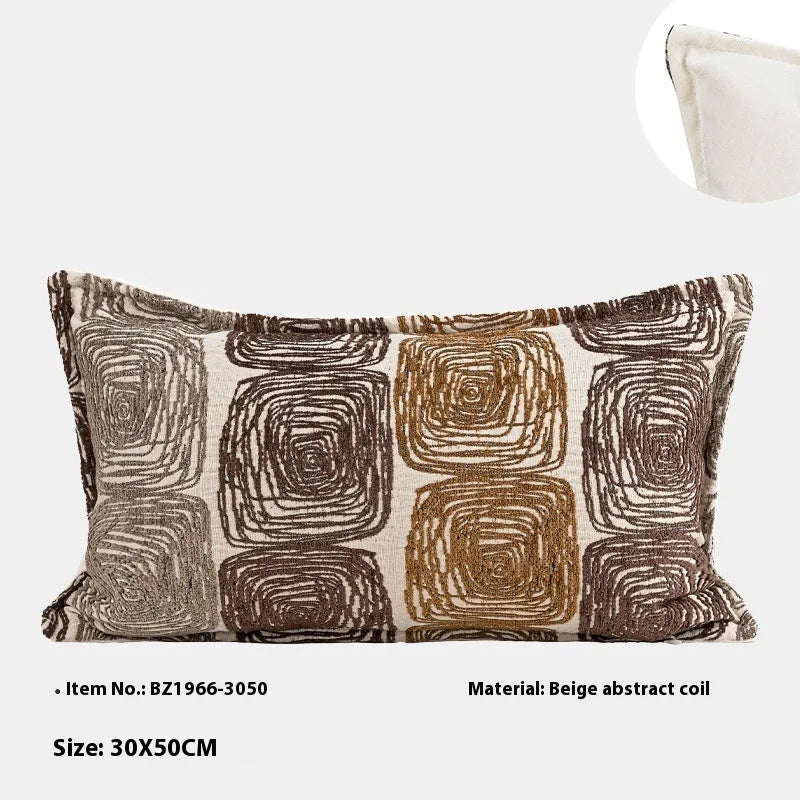 Cream and coffee-coloured abstract geometric coil pattern on a square pillow cover.