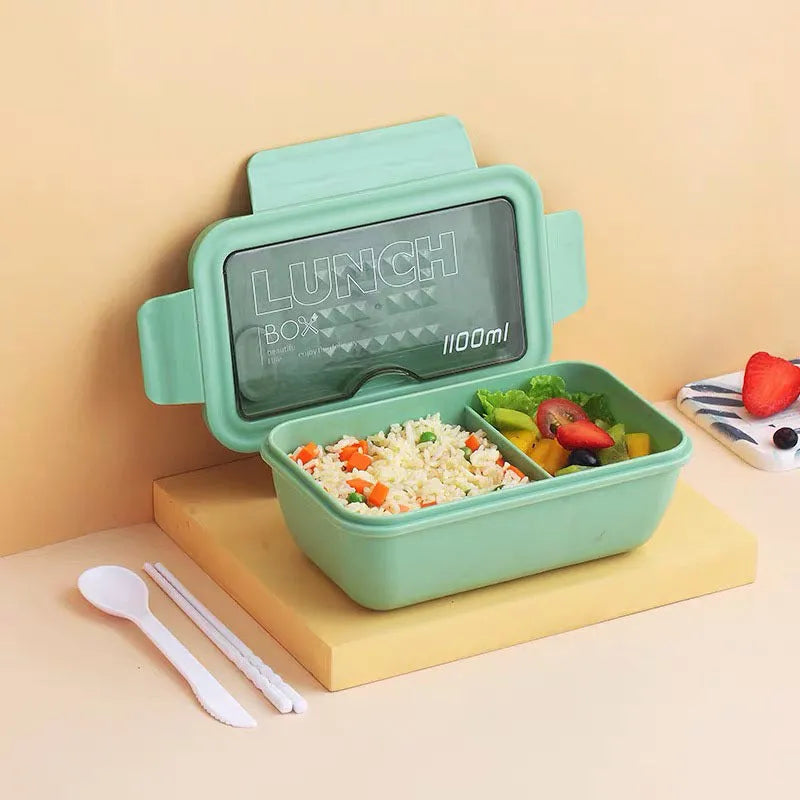 Green four-layer partitioned bento lunch box showing compartment separation