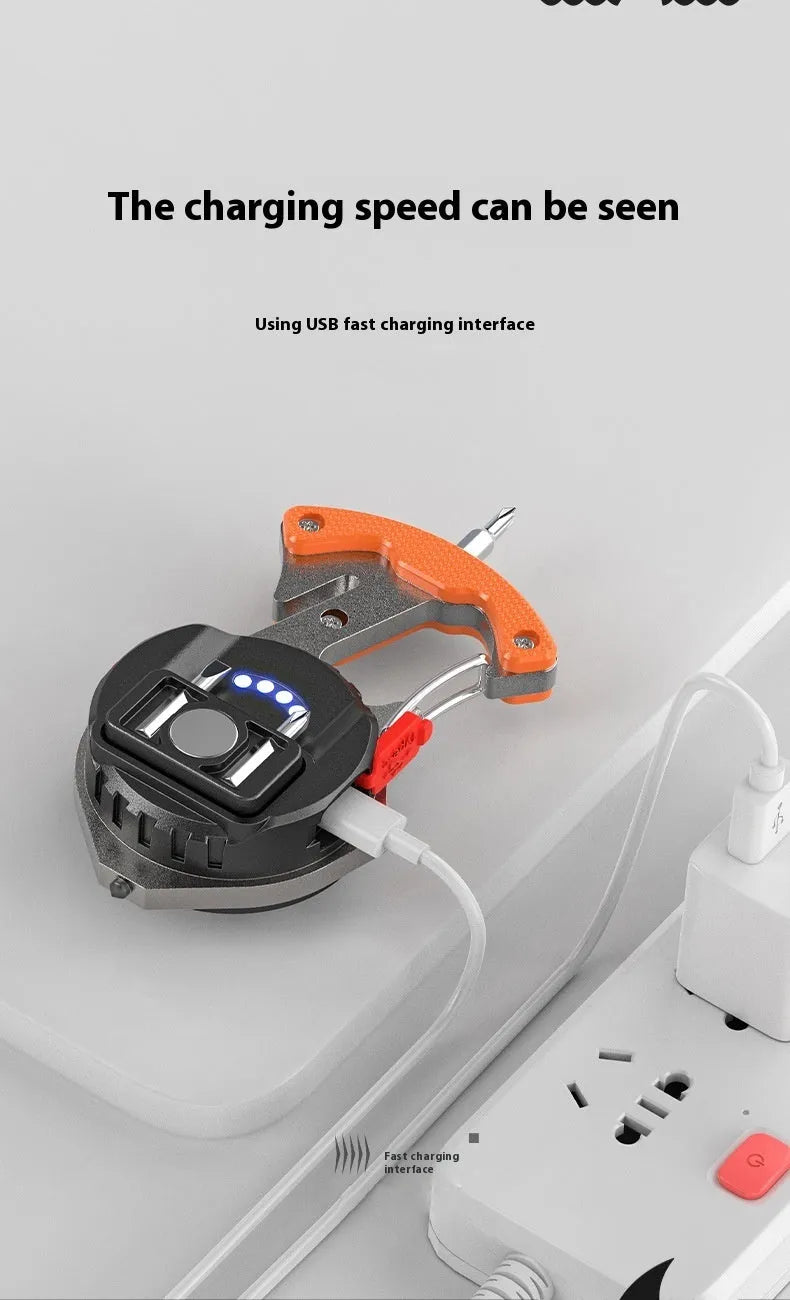 Compact silver and black multifunctional keychain flashlight with keyring, COB LED panel, and window breaker tool.