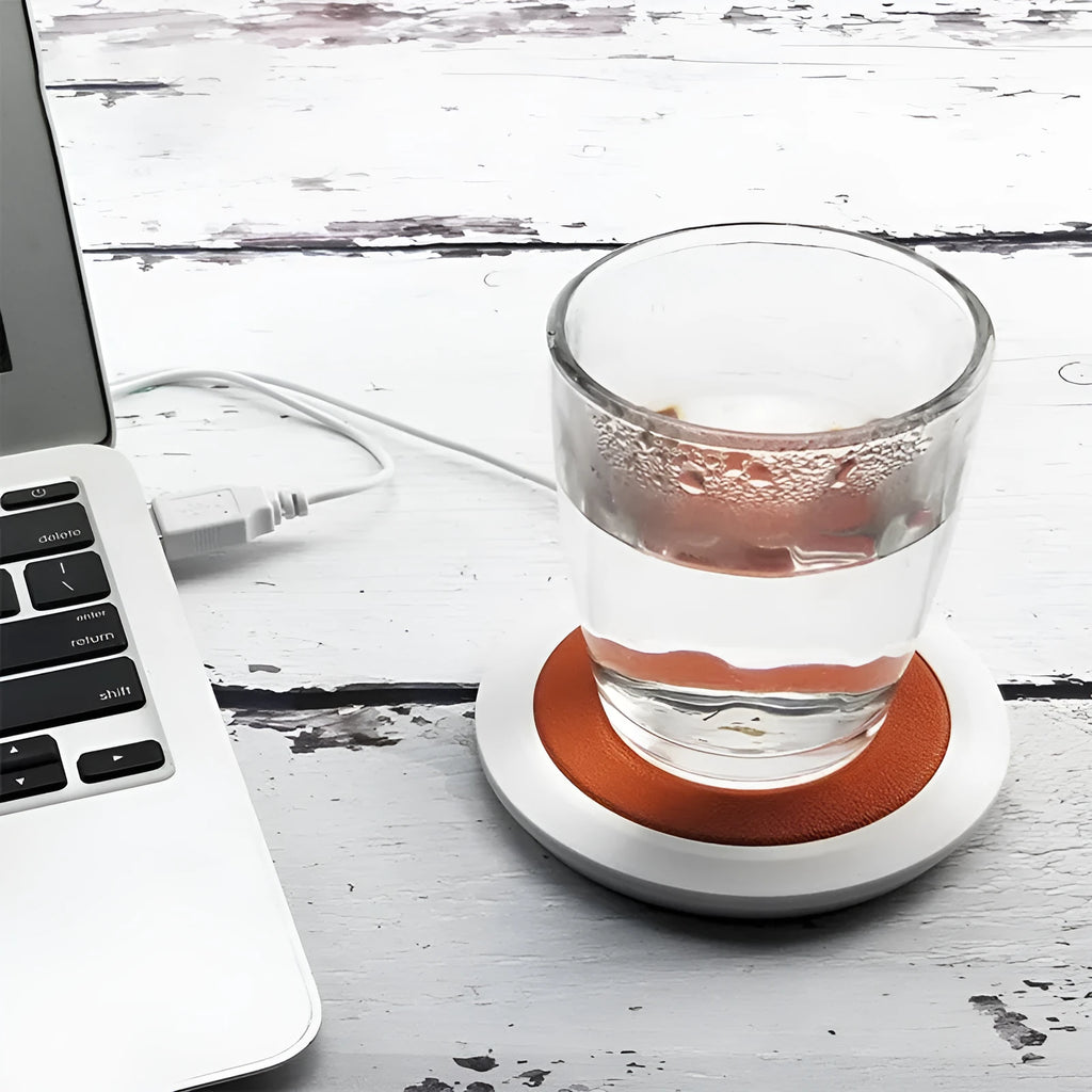 Black USB heating coaster for coffee mugs on office desk