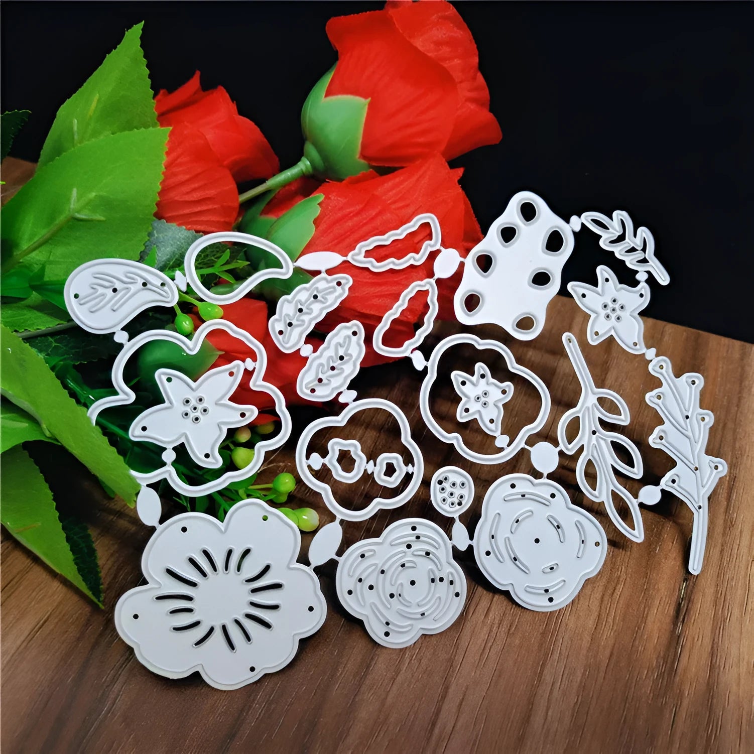 Silver carbon steel paper cutting die with floral plant design measuring 14.3 by 9.9 cm