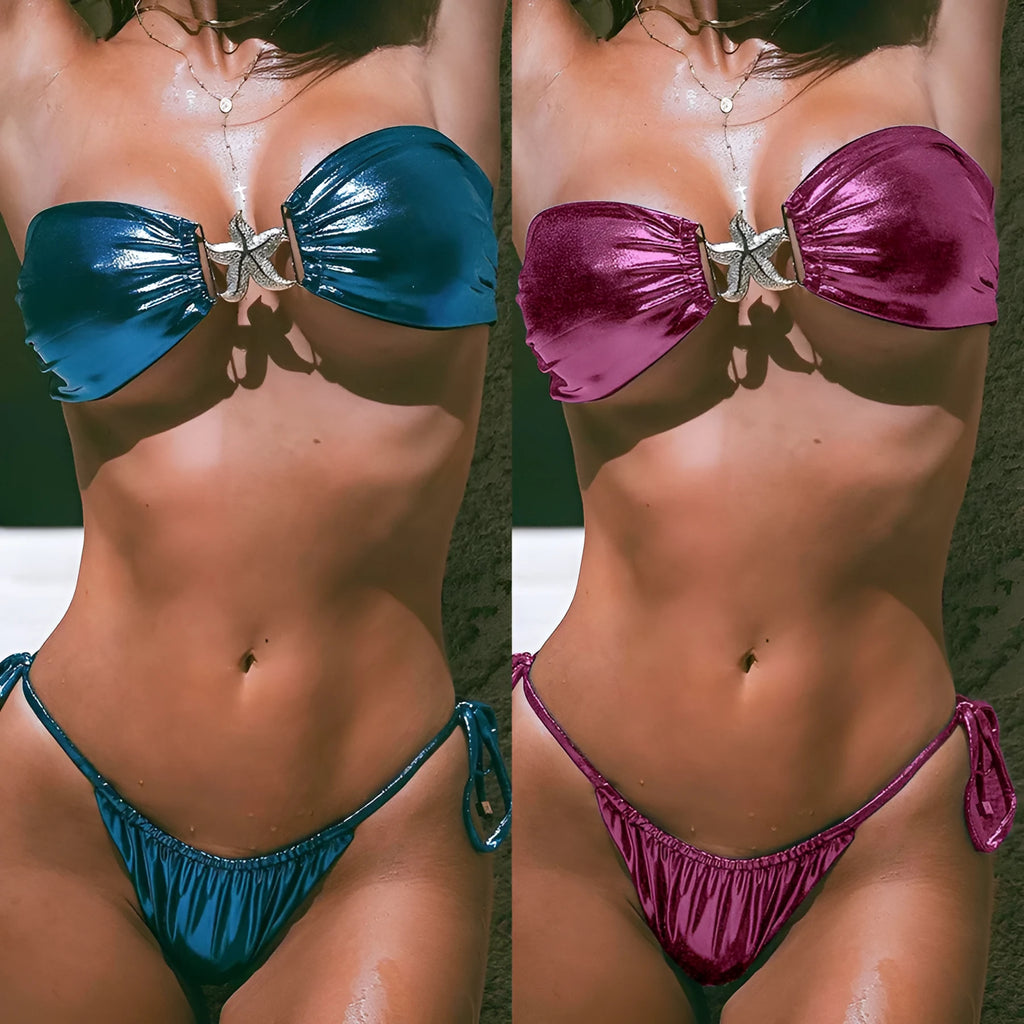 Glossy blue women's tube top bikini with gold starfish print on a beach.