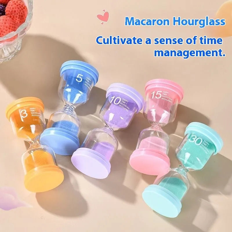 Handcrafted glass sand clock timer on a desk, showing blue sand, with modern simplicity design.