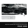 Oversized natural rubber gaming mouse pad with cold-themed graphic design showing keyboard and mouse placement