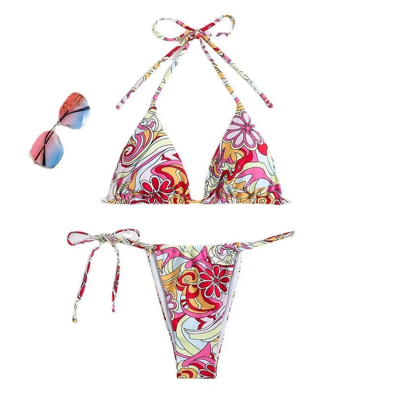 Multicolor printed women's triangle bikini top with hanging neck and matching bottoms.