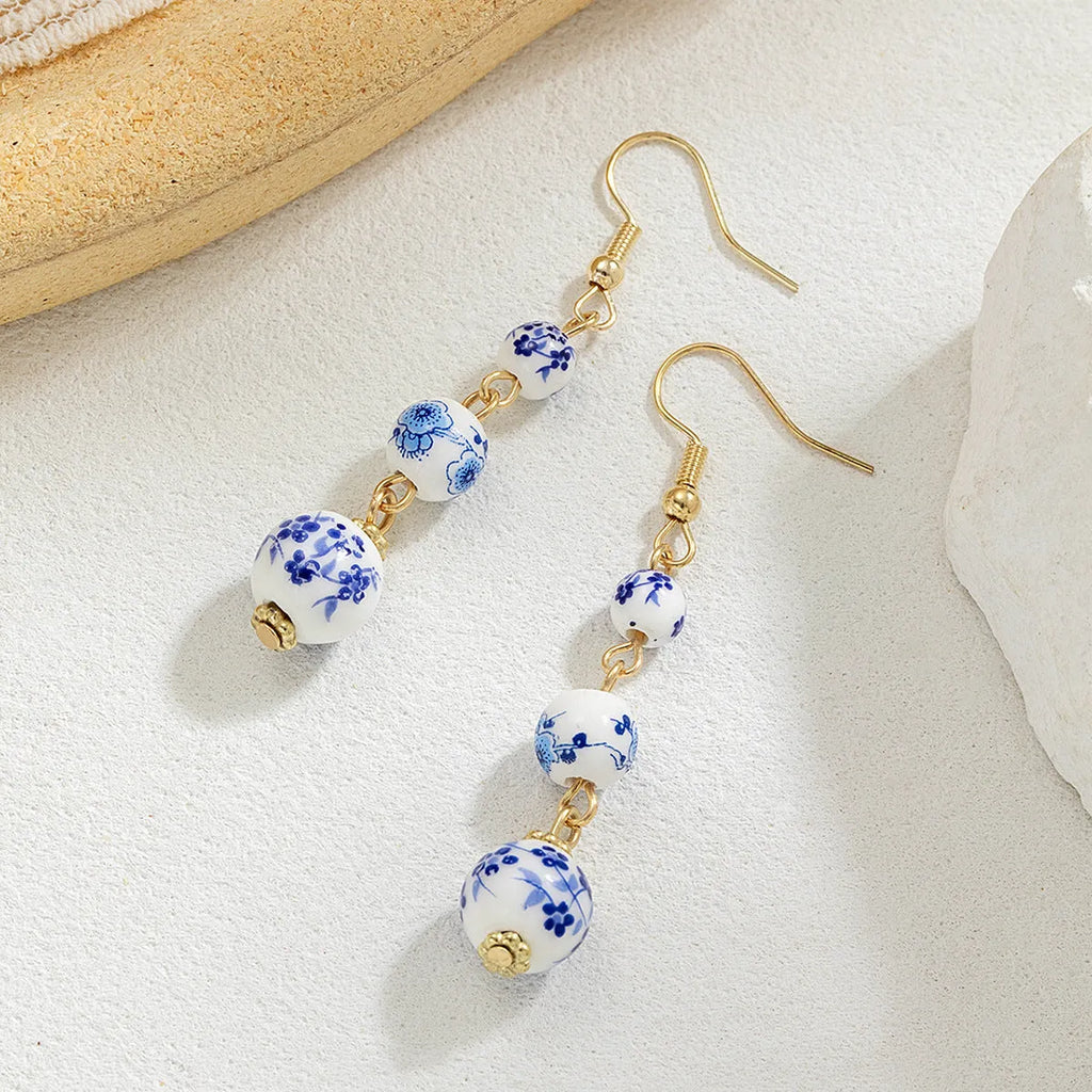Blue and white porcelain ceramic bead long earrings with geometric alloy elements