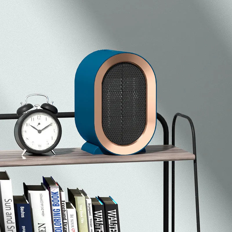 Mini portable electric heater with PTC ceramic heating and mechanical controls available in black blue green and white