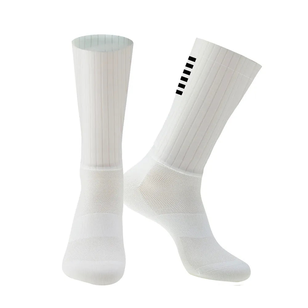 Athletic cycling and running socks in chemical fibre blend fabric, shown in orange, black, purple, white, grey or dark blue.
