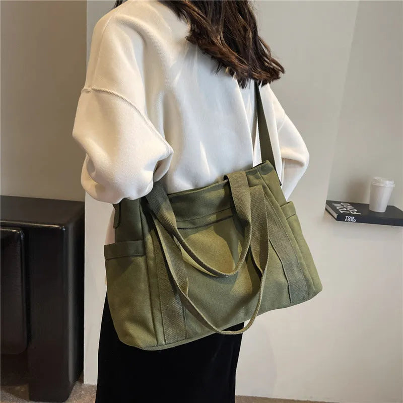Women's large canvas shoulder tote bag with sandwich pockets and phone compartment in solid colour
