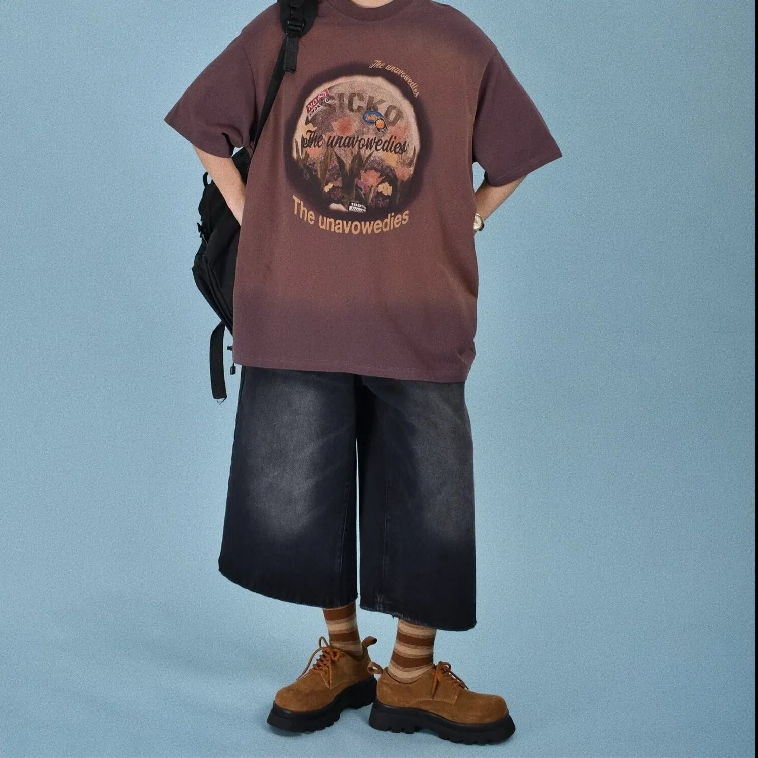 Men's loose straight denim shorts in blue colour showing five-part pants length design