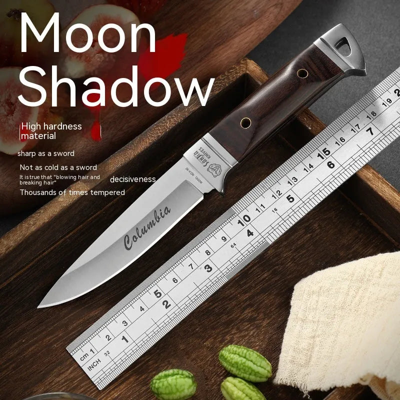 Stainless steel camping fruit knife with national style design in its leather case.